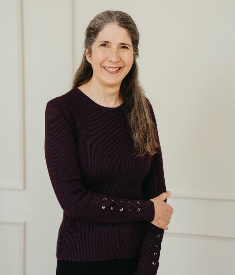 Smiling brunette in purple shirt